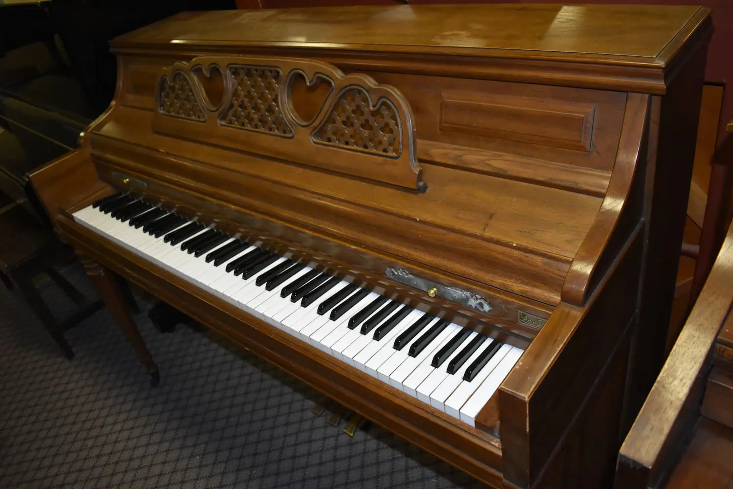 Used light-brown Kimball piano