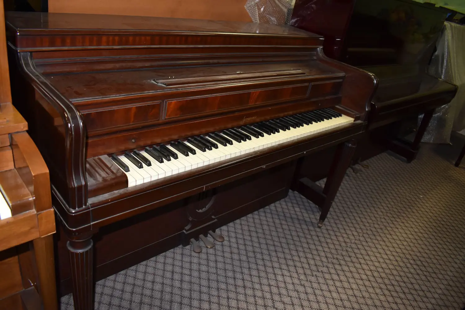 Used red Acrosonic upright piano